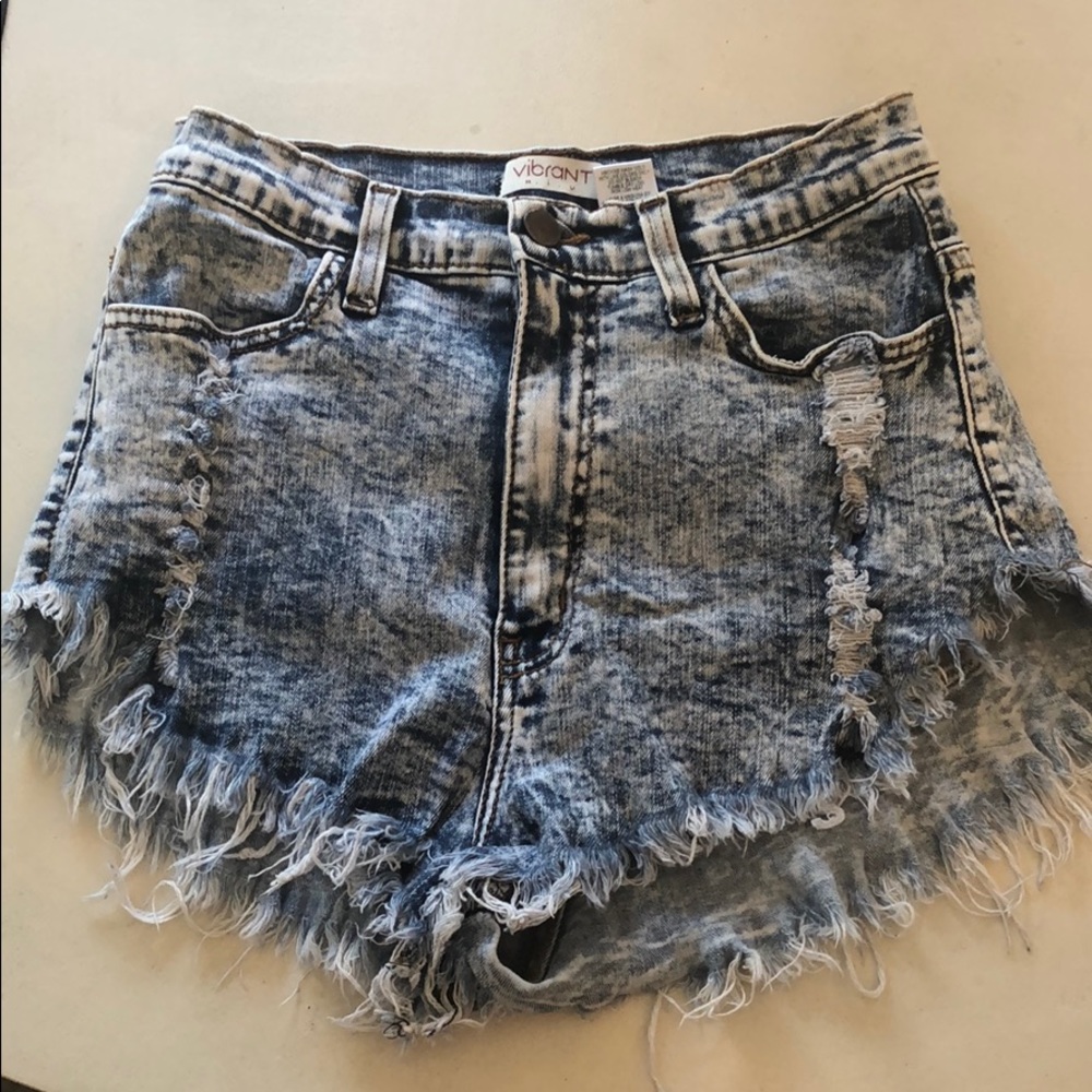 Vibrant distressed acid washed jean shorts